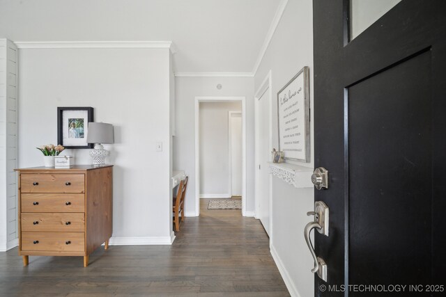 hallway featuring dark wood-type flooring and ornamental molding