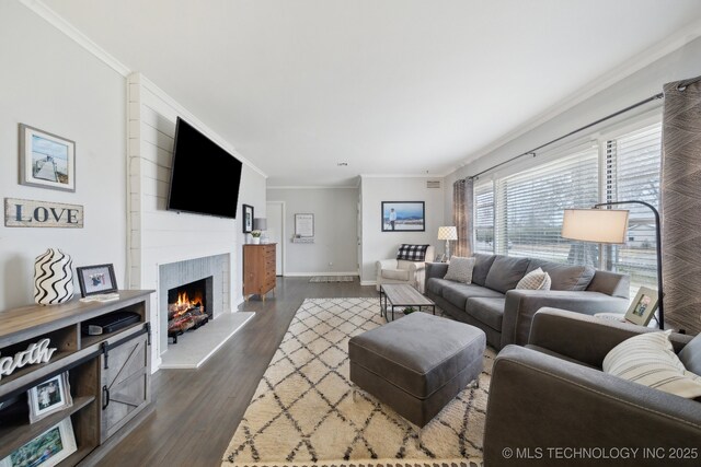 living room featuring crown molding and dark hardwood / wood-style floors