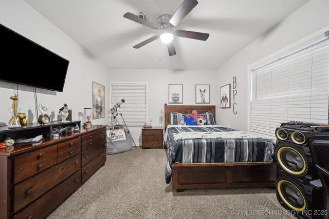 bedroom with light colored carpet and ceiling fan