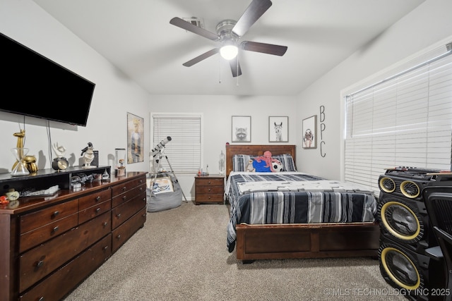 bedroom with light carpet and ceiling fan