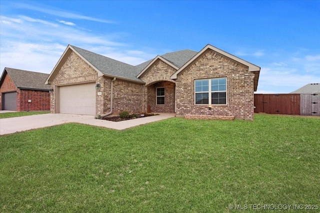 view of front of home featuring a garage and a front lawn