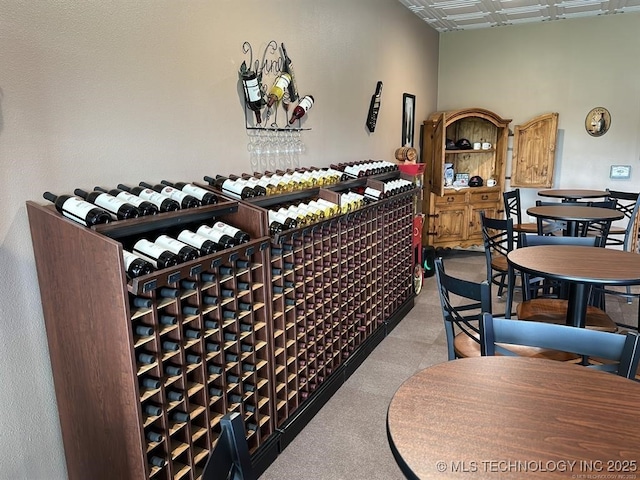 wine room featuring light carpet