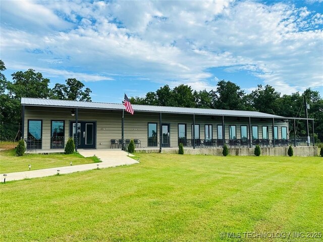 488 Rock House Rd, Bennington, OK 74723 - back of property with metal roof and a yard