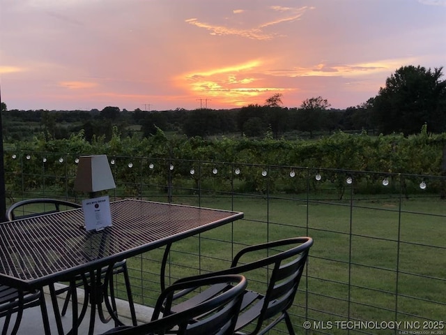 patio terrace at dusk with a yard