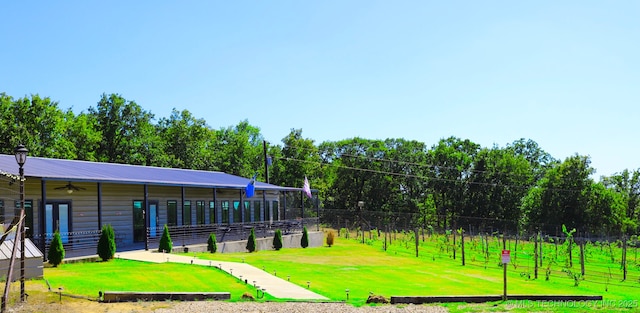 view of property's community with a yard