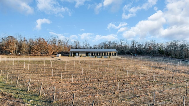 view of front of house with a rural view