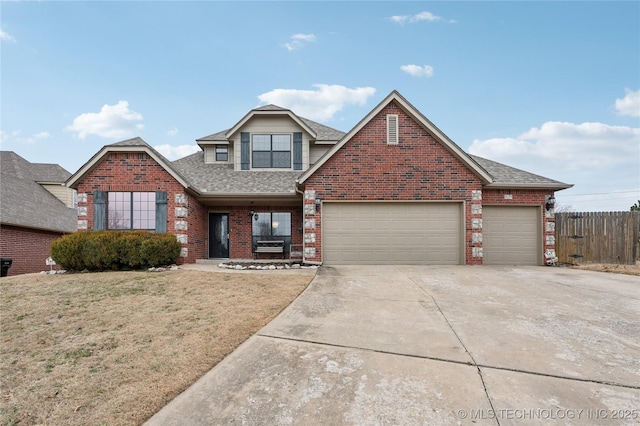 view of front property with a garage and a front lawn