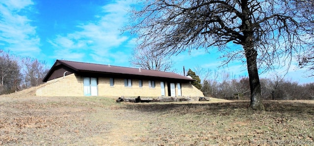 view of home's exterior with a yard