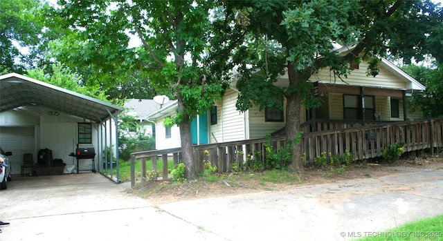 view of front of property with a carport