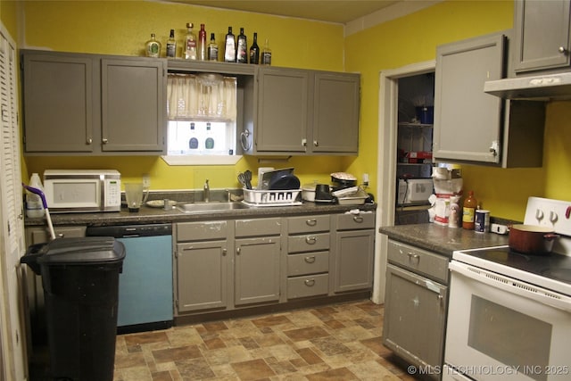 kitchen with sink, white appliances, and gray cabinets