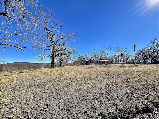 view of yard with a rural view