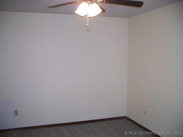 unfurnished room featuring dark carpet and ceiling fan