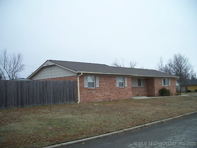 view of home's exterior with a lawn