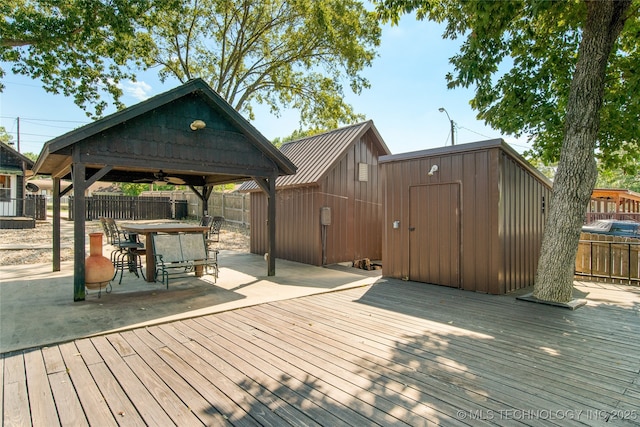 wooden terrace featuring a gazebo and a patio