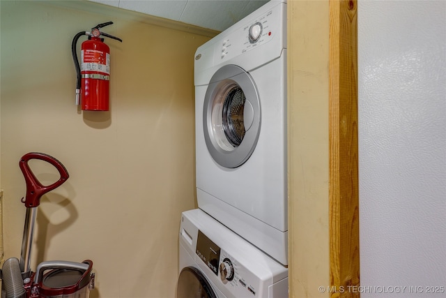 laundry room featuring stacked washing maching and dryer