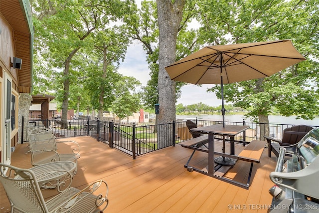 wooden terrace with a water view