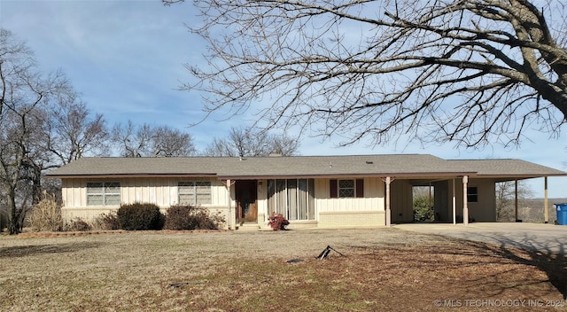 single story home featuring a carport