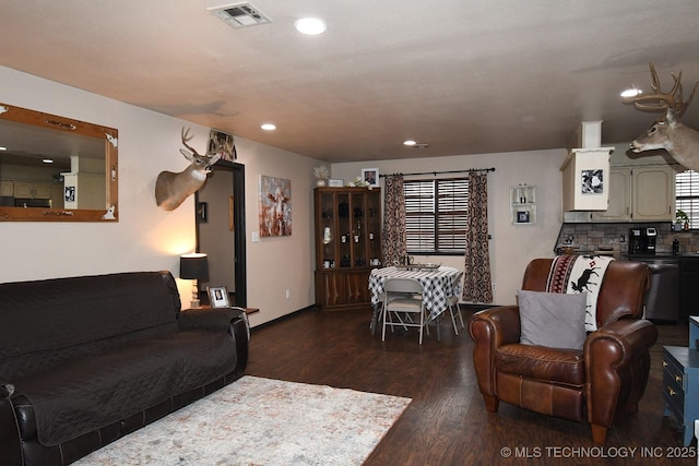 living room with dark hardwood / wood-style flooring