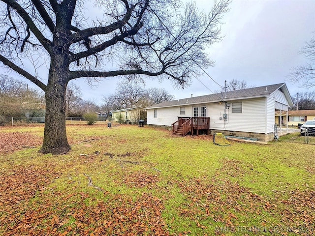 exterior space with a yard and a deck