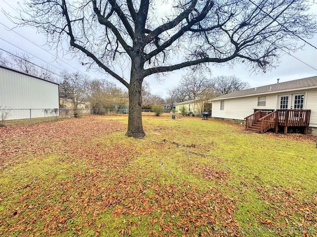 view of yard featuring a wooden deck