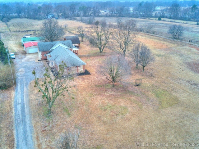 birds eye view of property featuring a rural view