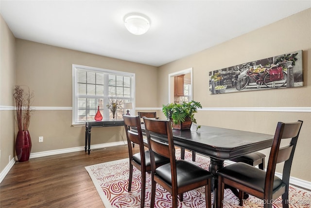 dining room featuring dark hardwood / wood-style flooring