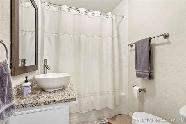 full bathroom featuring vanity, toilet, and shower / bath combo with shower curtain