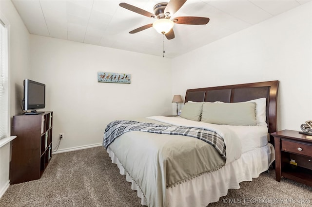 bedroom featuring ceiling fan and carpet