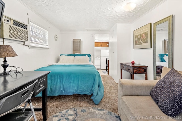 bedroom with a wall mounted AC, freestanding refrigerator, carpet, crown molding, and attic access