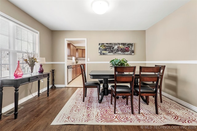 dining space featuring hardwood / wood-style flooring