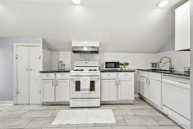 kitchen featuring white appliances, sink, decorative backsplash, and white cabinets