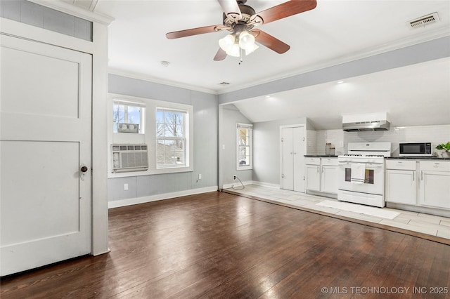 kitchen with white cabinetry, crown molding, dark hardwood / wood-style flooring, white appliances, and range hood