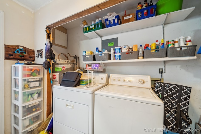 washroom with separate washer and dryer and water heater