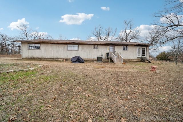 back of property with central AC unit