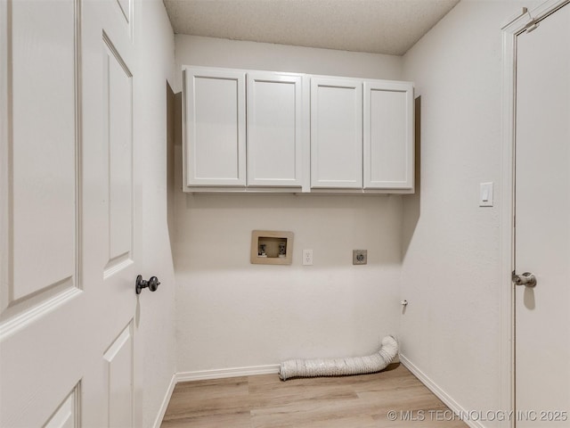 laundry room with light wood finished floors, hookup for a washing machine, cabinet space, hookup for an electric dryer, and baseboards