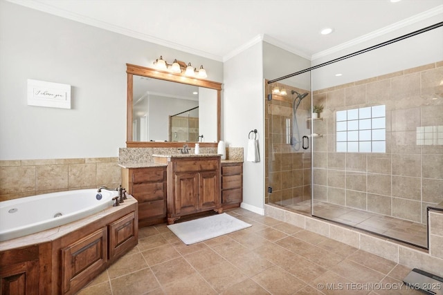 bathroom featuring a stall shower, ornamental molding, a tub with jets, tile patterned flooring, and vanity