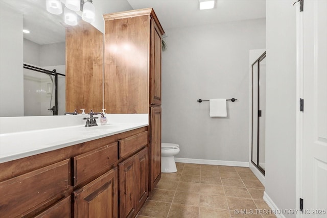 bathroom with vanity, a shower stall, and tile patterned flooring