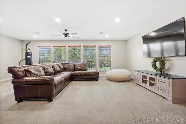 living area featuring recessed lighting, light colored carpet, visible vents, and baseboards