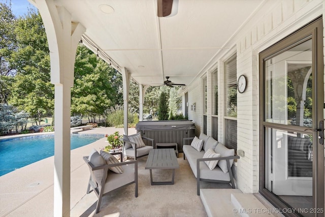 view of patio / terrace featuring ceiling fan, an outdoor hangout area, an outdoor pool, and a hot tub