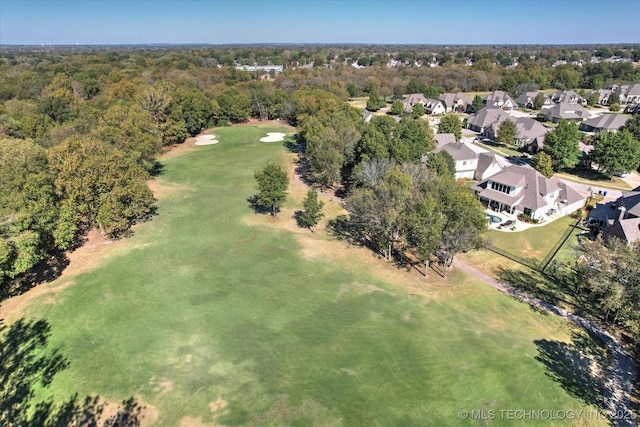aerial view featuring a wooded view and a residential view