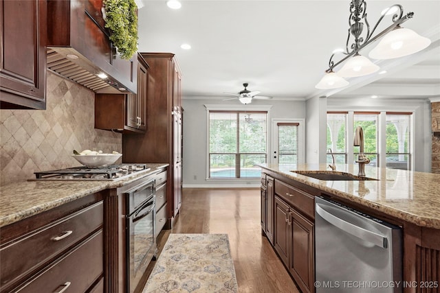8117 E Freeport St, Broken Arrow, OK 74014 - kitchen featuring stainless steel dishwasher, a sink, crown molding, tasteful backsplash, and wood finished floors