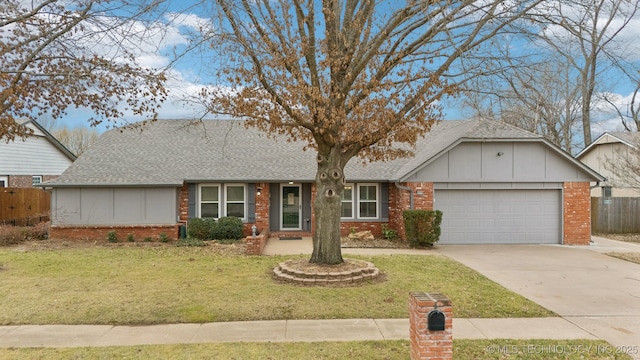 ranch-style home with a garage and a front yard