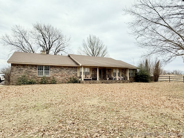 single story home featuring covered porch