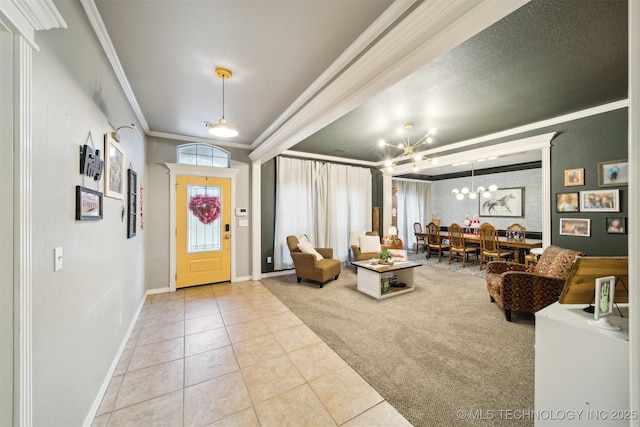 tiled foyer with an inviting chandelier and ornamental molding