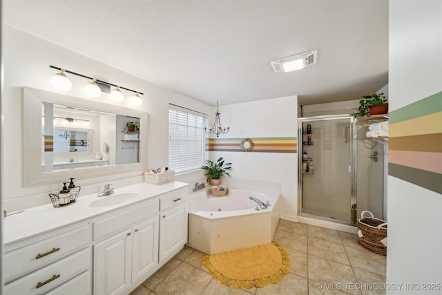 bathroom featuring independent shower and bath, vanity, and tile patterned floors