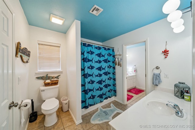 bathroom with tile patterned flooring, vanity, a shower with curtain, and toilet