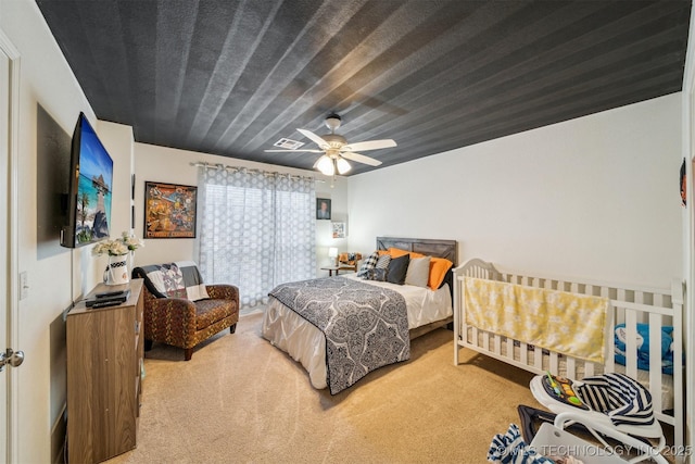 bedroom with ceiling fan and carpet floors