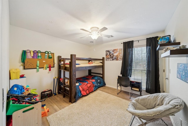 bedroom featuring wood-type flooring and ceiling fan