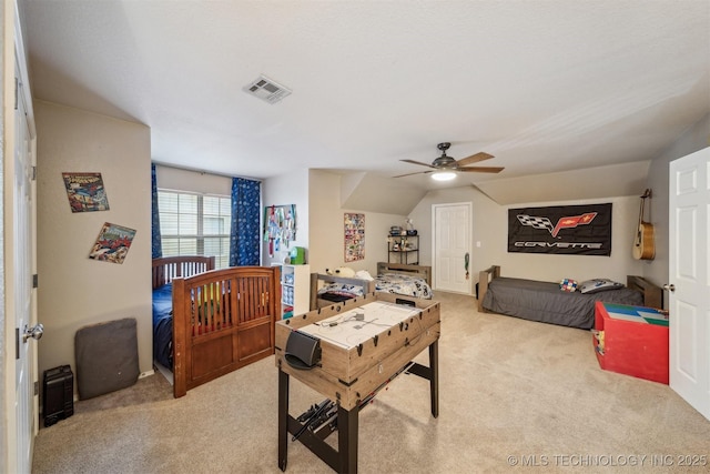 carpeted bedroom featuring lofted ceiling and ceiling fan