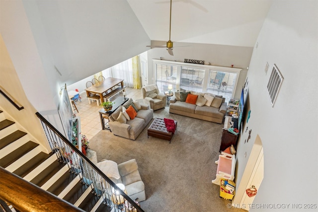 living room with high vaulted ceiling, light tile patterned floors, and ceiling fan